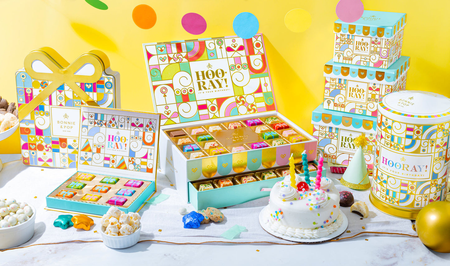 Make every birthday unforgettable. This three-tier birthday gift tower is packed with chocolates, cookies, nuts, and festive treats—beautifully wrapped and ready to wow.