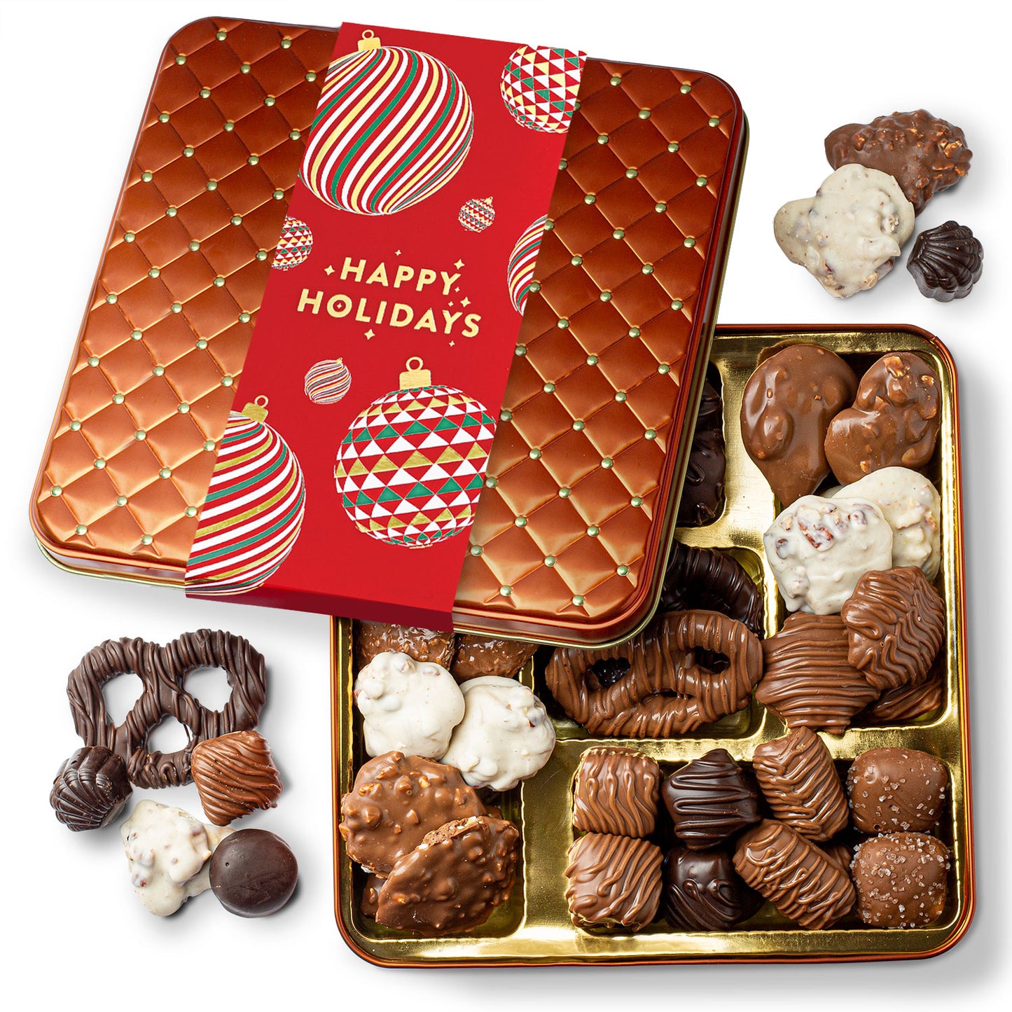 A variety of chocolates with different textures and finishes, presented in a gold tin with a festive red 'Happy Holidays' lid. The chocolates appear to include milk and dark varieties, possibly with holiday-themed decorations and flavors.