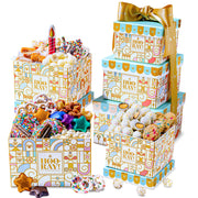A three-tiered gift tower with an assortment of chocolate covered and other sweet snacks, wrapped in birthday-themed packaging with decorative gold ribbon.