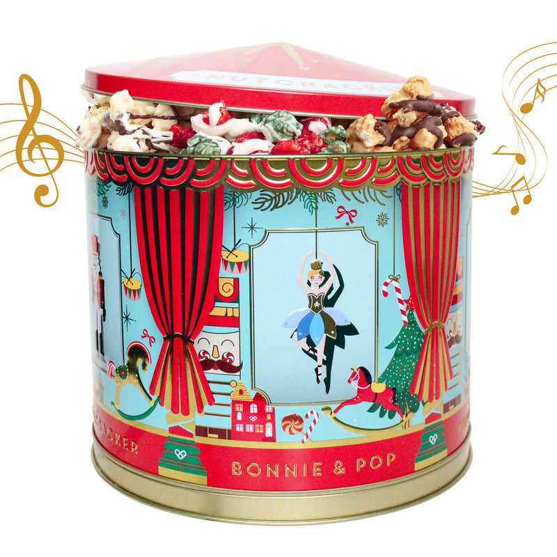 Decorative candy tin with nutcracker-themed design and filled with flavored popcorn.