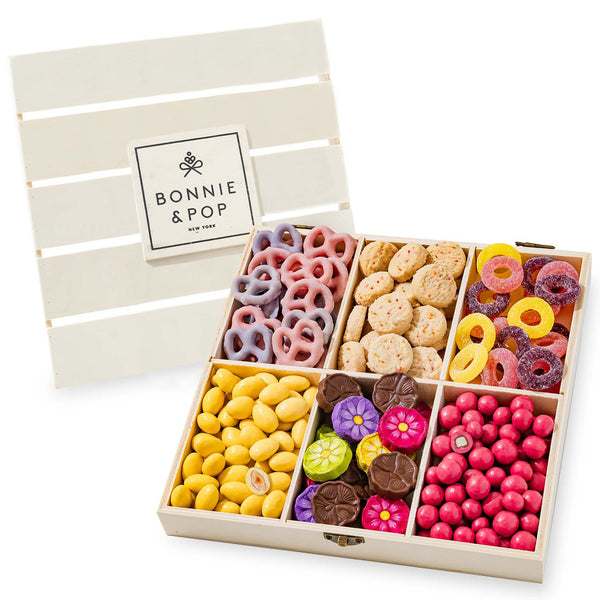 Gift Basket | Candy and Nut Sweet Gourmet Snack Box | Chocolate Flowers and Candy | Best Gift Idea for Mom, Women, Her, Mother, Grandmother. This gourmet snack gift box features a wooden crate with a removable lid, partitioned into six compartments contai