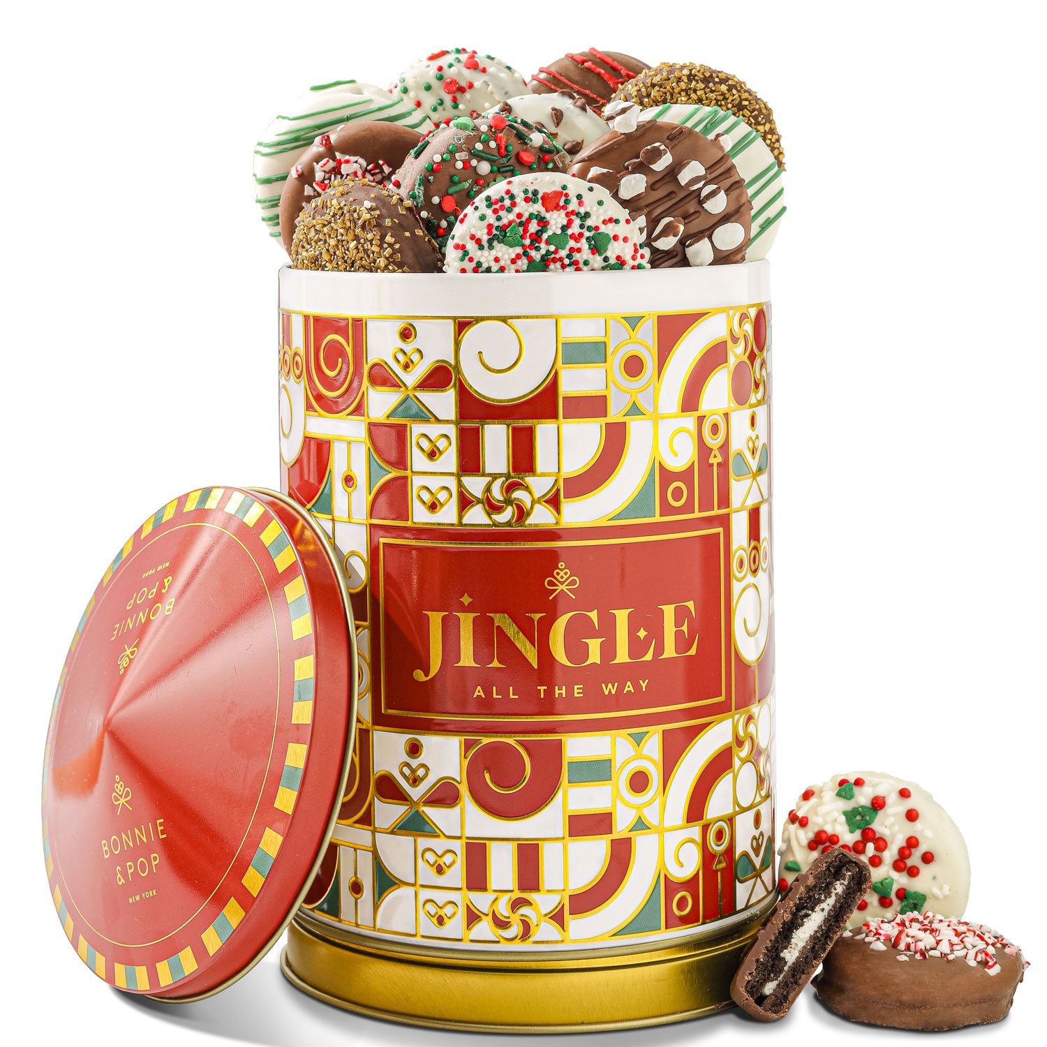 A festive tin with 'JINGLE ALL THE WAY' text, adorned with multicolored accents, filled with milk and white chocolate covered Oreos with holiday toppings.